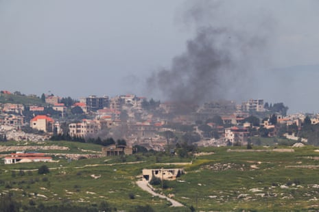 Distant view of smoking rising in Lebanon, as seen from the Israeli side of the border.