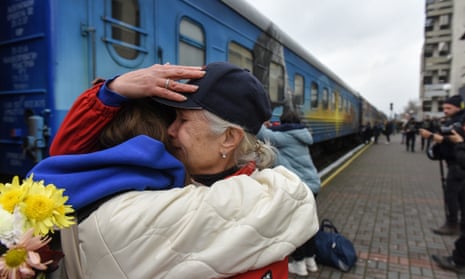 A grandmother and her granddaughter hug each other as they meet at the railway station in Kherson – the first passenger train to arrive from Kyiv since the start of Russia’s invasion of Ukraine.