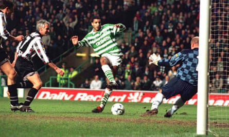 Pierre Van Hooijdonk beats Dunfermline keeper Ian Westwater to score for Celtic in 1996.