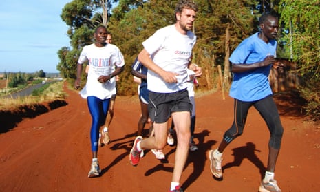 Adharanand Finn running with a group of Kenyans