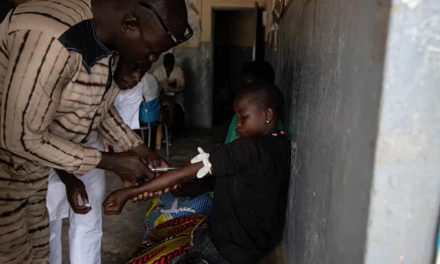 A girl is given an anti-malaria injection in Ziniare, north-east of Burkina Faso’s capital Ouagadougou.