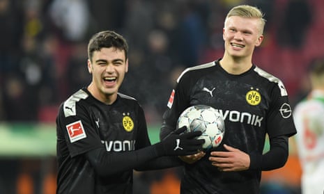 Giovanni Reyna of Borussia Dortmund hands the match ball to his teammate Erling Haaland after the Norwegian’s extraordinary hat-trick against Augsburg.
