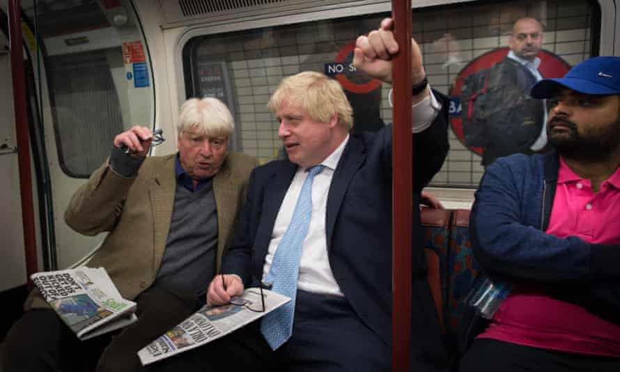 Boris Johnson sits next to his father Stanley (left) on the tube