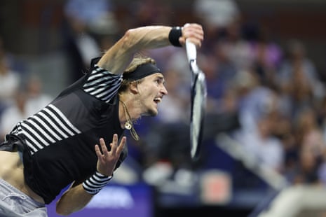 Alexander Zverev of Germany returns the ball to Carlos Alcaraz of Spain  during their semi final