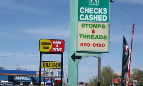 An Ace Cash Express outlet is seen on San Mateo Boulevard in Albuquerque, New Mexico. The outlet sits on a block which has three small loan storefronts.