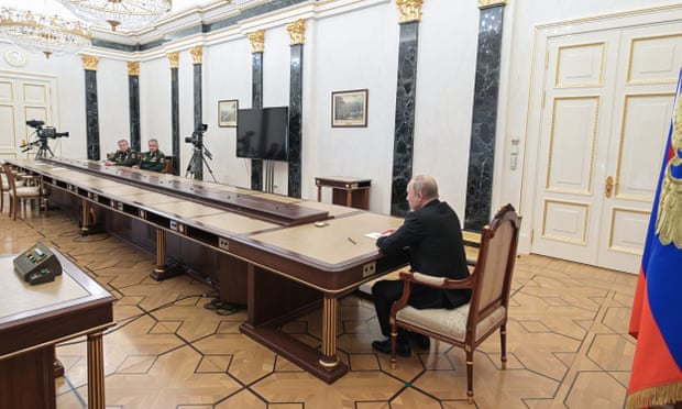 Vladimir Putin speaks to the Russian defense minister Sergei Shoigu head of the general staff of the Russia’s armed forces, Valery Gerasimov.