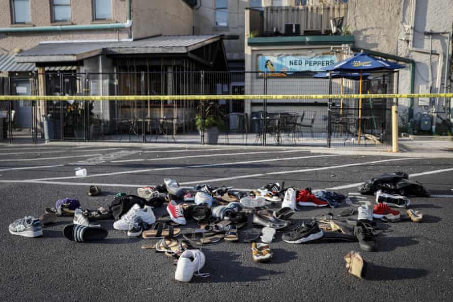 Pairs of shoes belonging to victims piled behind the Ned Peppers bar.