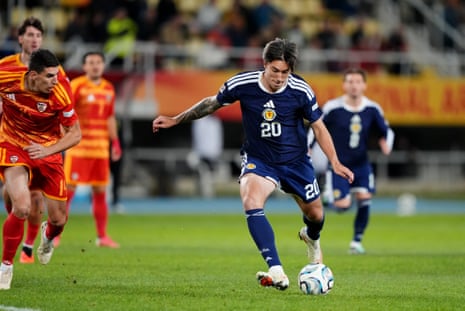 Scotland's Kieron Bowie thumps the ball home to give the visitors the lead.