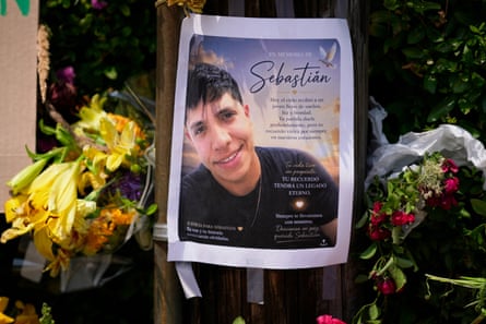 A poster outside showing the image of a man smiling next to bouquets of flowers