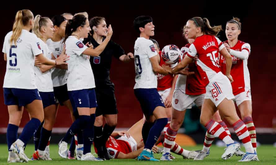 Players clash during the match.