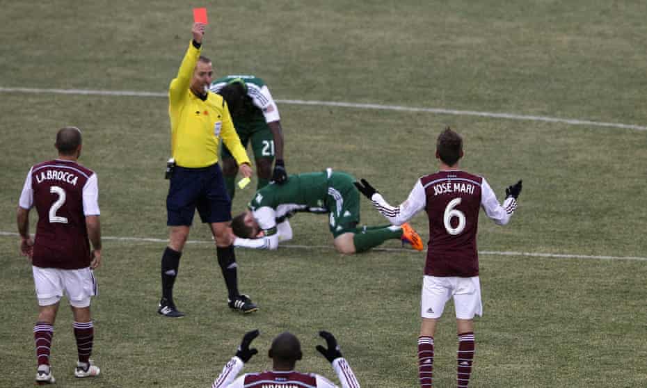 Jose Mari of Colorado Rapids receives his second yellow card from referee Mark Geiger against the Portland Timbers.