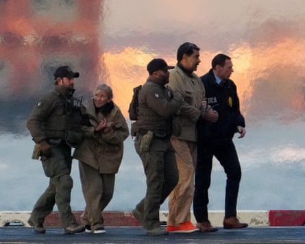 Law enforcement officials surround Nicolás Maduro and his wife, Cilia Flores