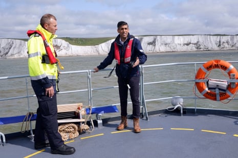 Rishi Sunak with Duncan Capps, the director of Small Boats Operational Command (SBOC) (left), onboard the Border Agency cutter HMC Seeker before his speech in Dover.