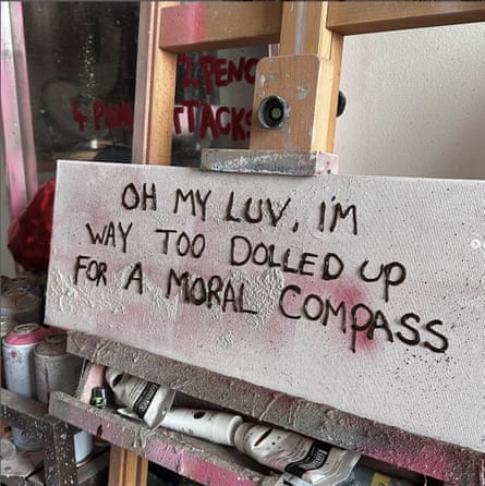 A canvas with the words "Oh my luv, I'm way too dolled up for a moral compass" painted on it