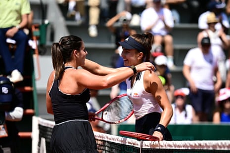 Iva Jovic (right) and Emma Navarro embrace after Jovic’s victory.