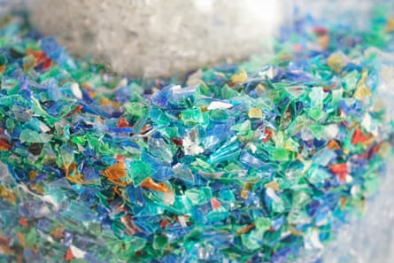 Tiny pieces of plastic in a glass container
