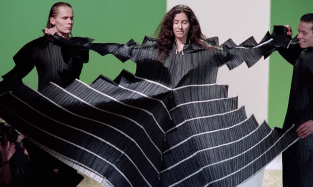 Models display pleats as part of Issey Miyake's Fall-Winter 1995 ready-to-wear collection in Paris.