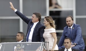 Carlos Bolsonaro, far right, accompanies the first lady and his father, Jair Bolsonaro, to his swearing-in in Brasília on 1 January 2019. 2000.jpg?width=300&quality=85&auto=forma