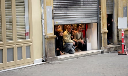 People take shelter inside a shop