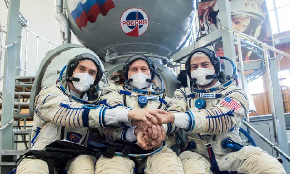 Russian cosmonauts Pyotr Dubrov, Oleg Novitskiy and Nasa astronaut Mark Vande Hei train ahead of their expedition to the International Space Station in March last year.
