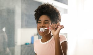 Teenage girl brushing her teeth.