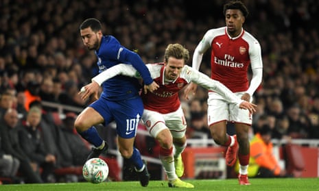 Chelsea’s Eden Hazard tangles with Nacho Monreal in the Carabao Cup semi-final second leg.