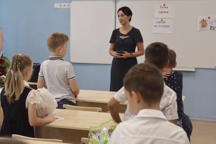 Pupils in a classroom in Mariupol following its takeover by Russian-backed separatist forces. The sign on the board reads ‘The theme of the lesson is my history’.