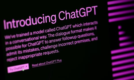 A computer monitor displaying 'Introducing ChatGPT'.