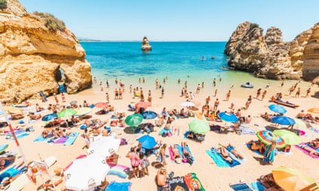 Bathers on Camilo Beach, Lagos, on the Algarve, Portugal.