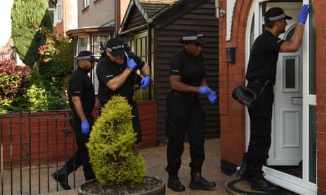 Police enter an address in Nuneaton after a man was arrested in connection with the Manchester Arena bombing.