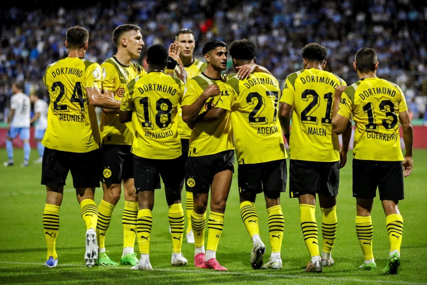 Dortmund's Karim Adeyemi (3-R) celebrates with his teammates after scoring the 3-0 lead during the German DFB Cup first round