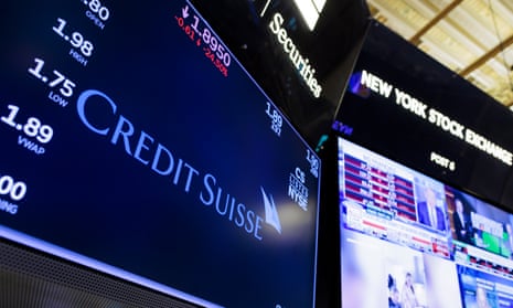 A screen displays information about Credit Suisse bank on the floor of the New York Stock Exchange in New York, New York, USA, on 15 March 2023