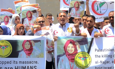 Palestinian medics protest in Gaza against the killing of the nurse Razan Al-Najjar, who was shot dead by Israeli soldiers.