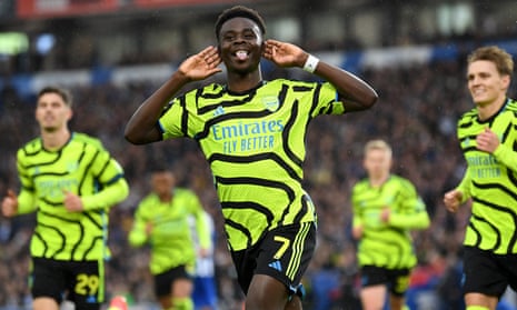 Bukayo Saka celebrates after his penalty puts Arsenal in front at Brighton.