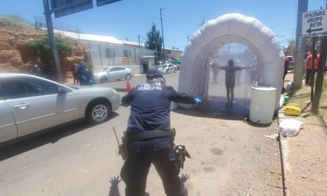 Sanitizing tunnels have been set up in Nogales, Mexico to disinfect people coming from Arizona.