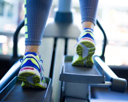 Woman training on ellipse