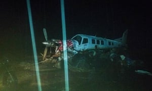 A damaged plane surrounded by floodwaters in Papua, Indonesia.