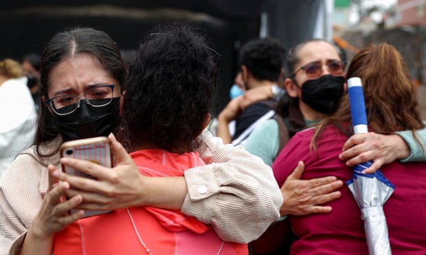 People react to an earthquake in Mexico CityPeople react after an earthquake, in Mexico City on Monday.