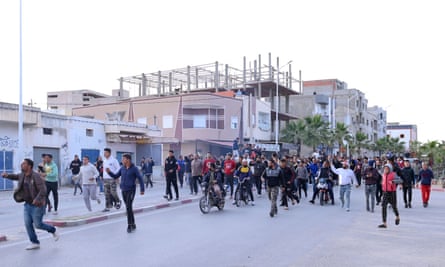 Mourners marching towards the local police station in Haffouz.