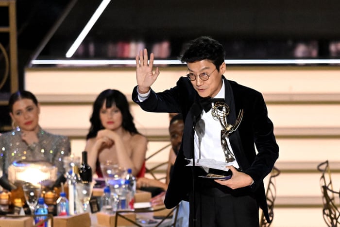 South Korean director Hwang Dong-hyuk accepts the award for best director of a drama series for Squid Game.