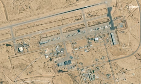 High-=up aerial view of a military airbase in a desert