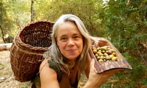 Woniya Thibeault holds up some acorns.