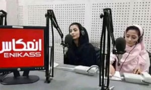 Nadia Momand and Haya Habibi siting in a studio in front of microphones
