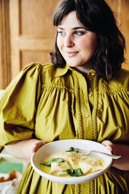 Julia Busuttil Nishimura holds a plate of her pumpkin tortelli
