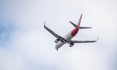 A Qantas plane lands at Adelaide airport