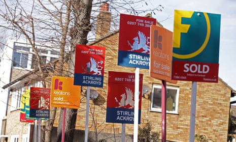 A row of estate agent signs 