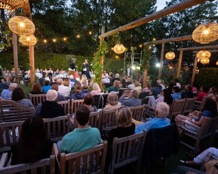 a pub audience enjoying a performance of Shakespeare in the garden