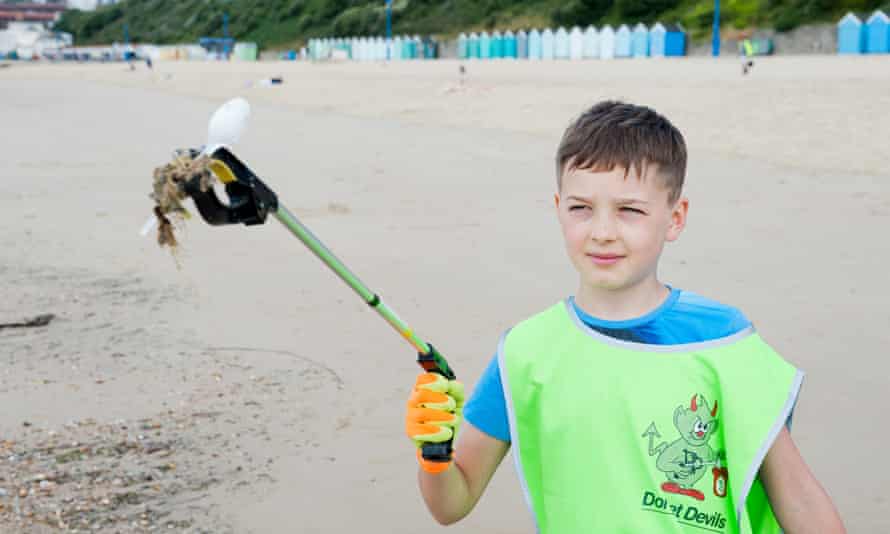 A young volunteer on the beach.