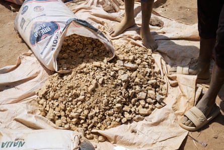 Broken rocks spill out of a sack