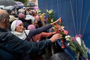 People place flower on the side of a lorry